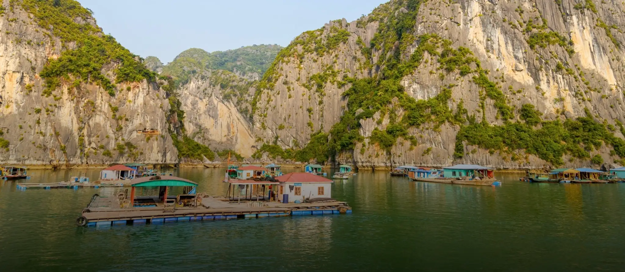 Floating fishing village between karst islands in Ha Long Bay