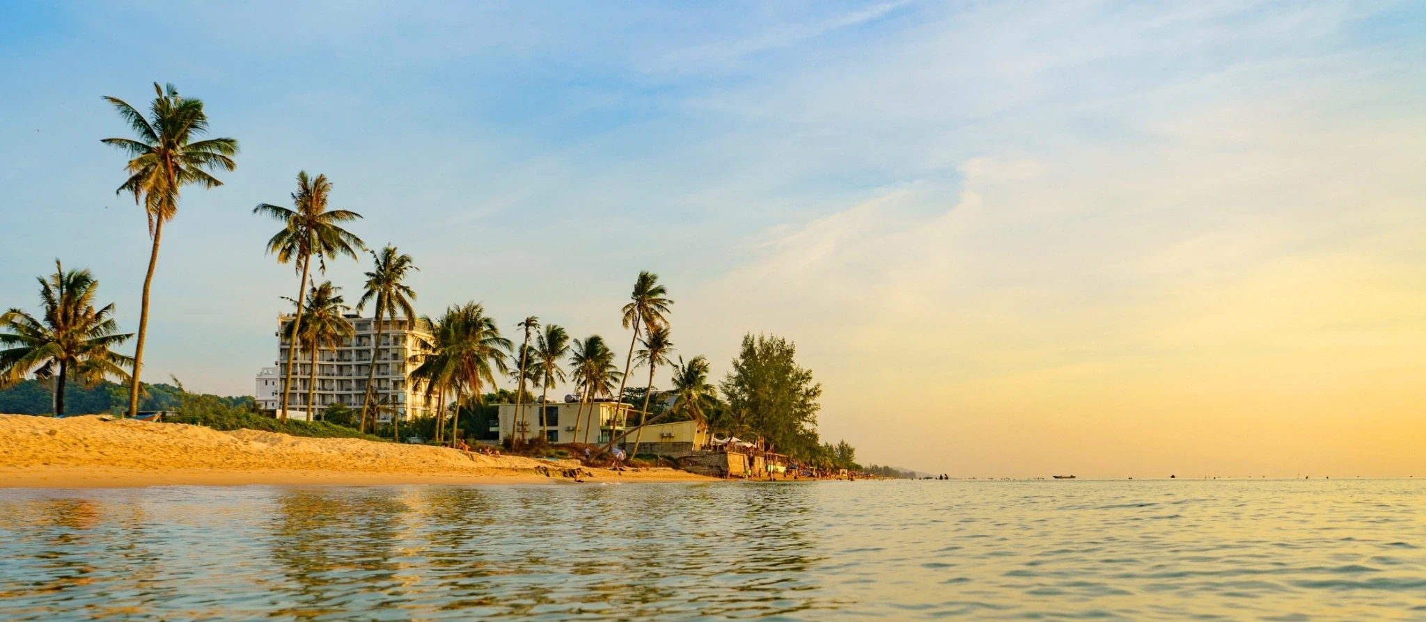 Empty white-sand beach and clear shallow water on Phu Quoc island